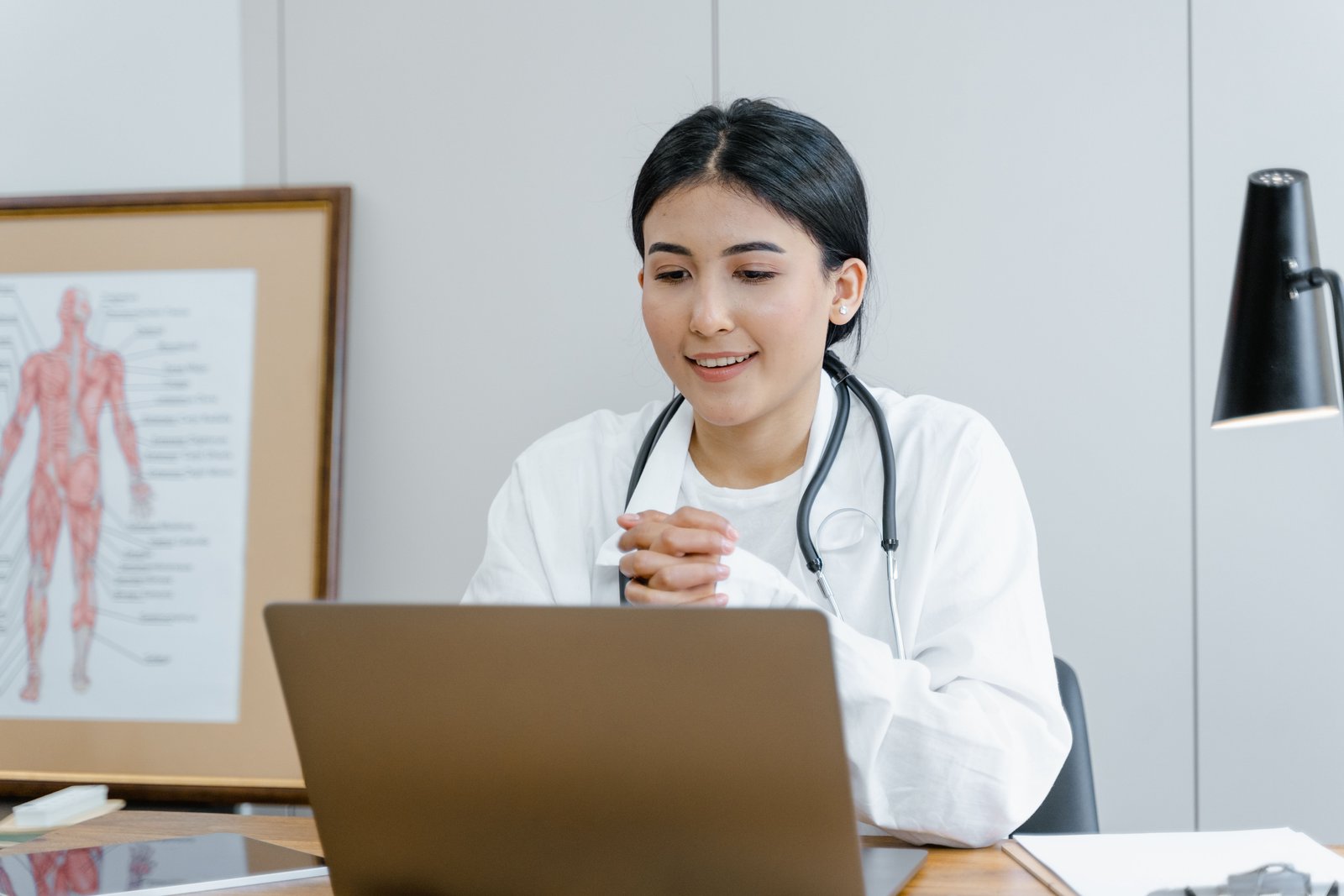A clinician connecting with a colleague over video